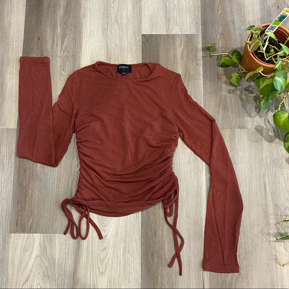 Long sleeve shirt with adjustable tie sides!